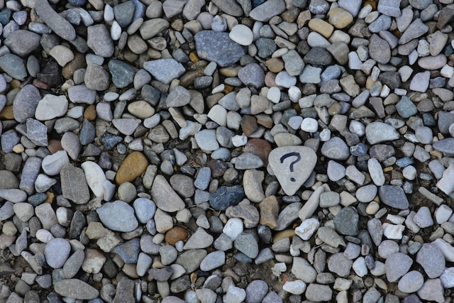 A question mark on some stones from the beach